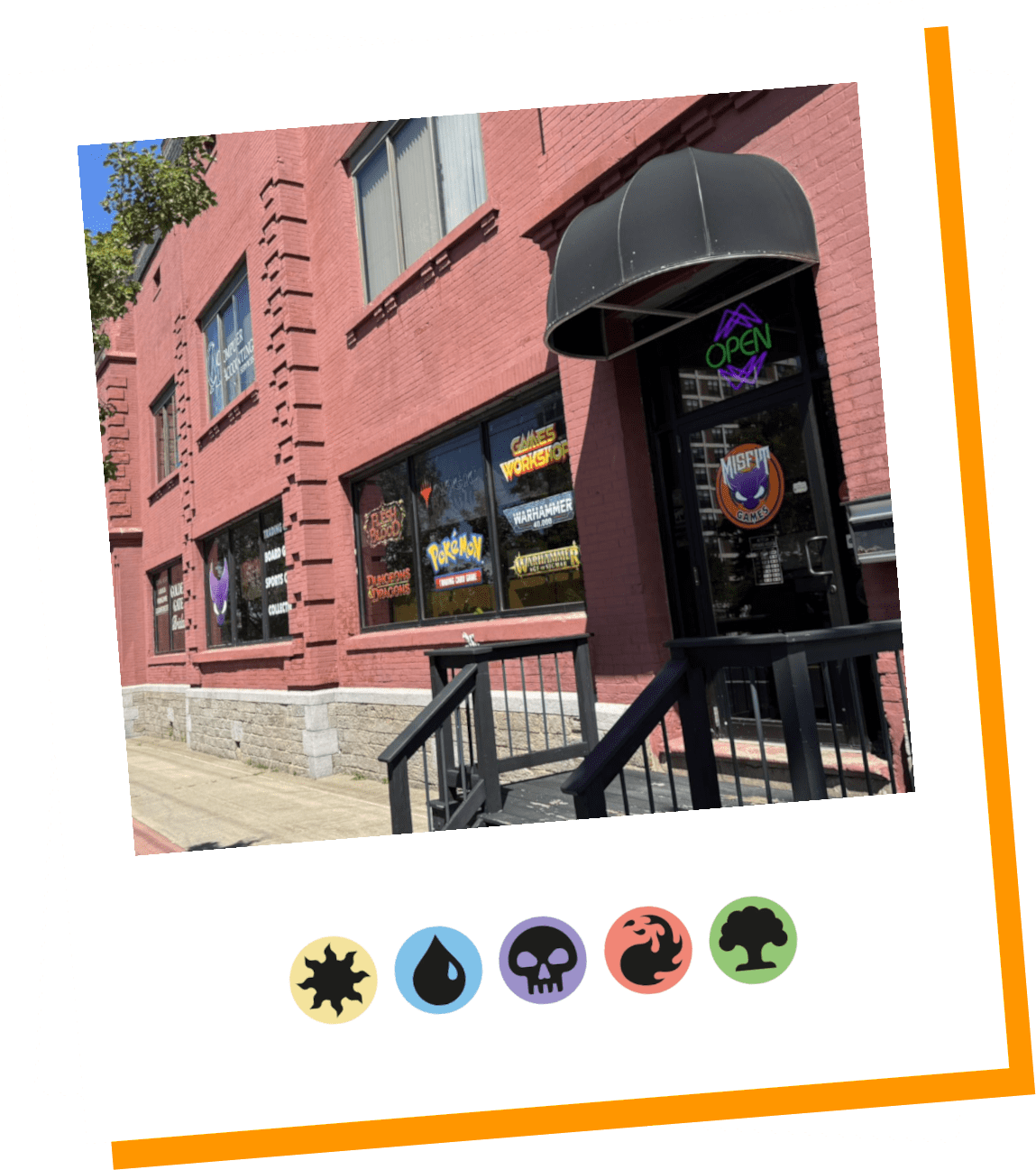 Exterior of a brick building with a black awning and colorful signage.
