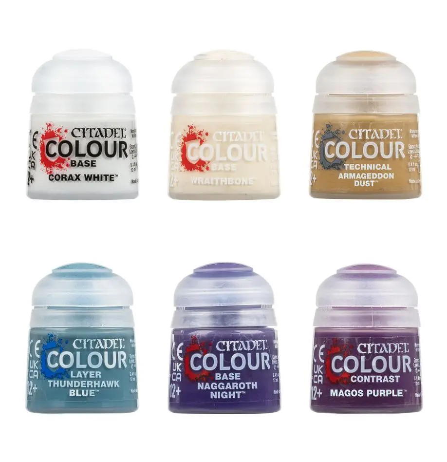 Six miniature paint pots in various colors for crafting.