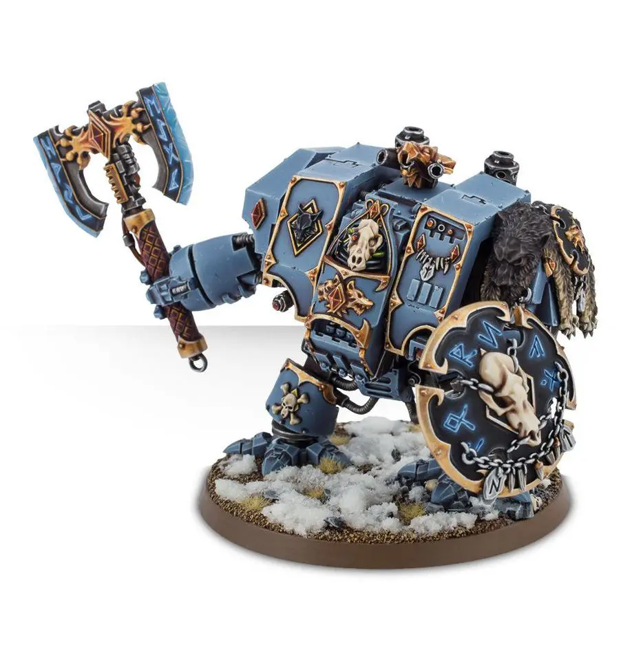 Blue armored warrior with a large axe and shield on a snowy base.