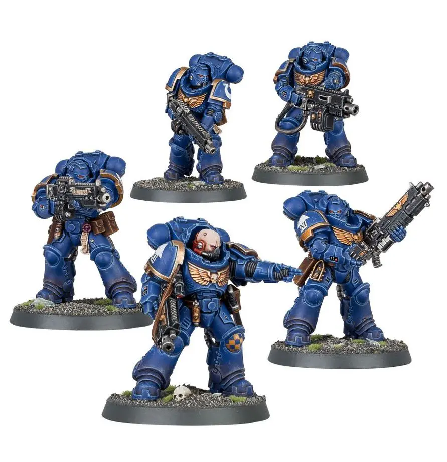 Five detailed blue-armored miniature soldiers in dynamic poses with weapons.