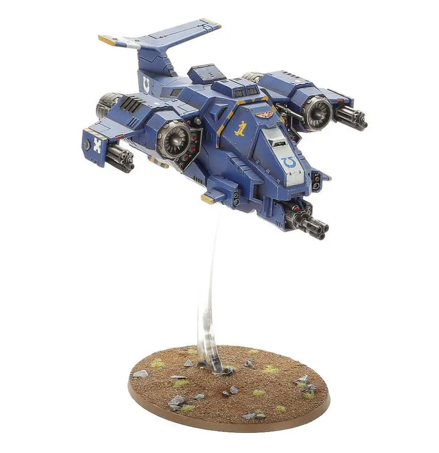 A blue and gray futuristic spaceship model on a display stand.