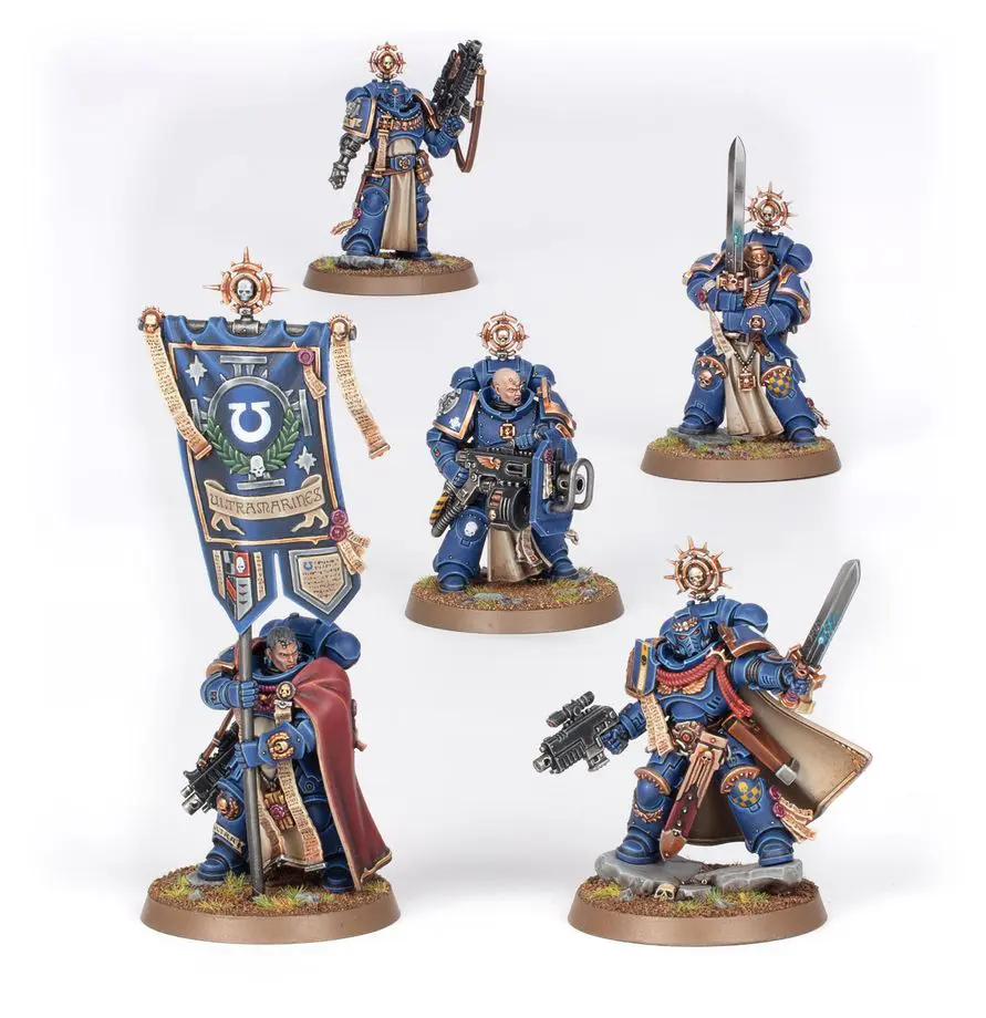 Detailed painted Warhammer miniatures in blue armor with weapons.