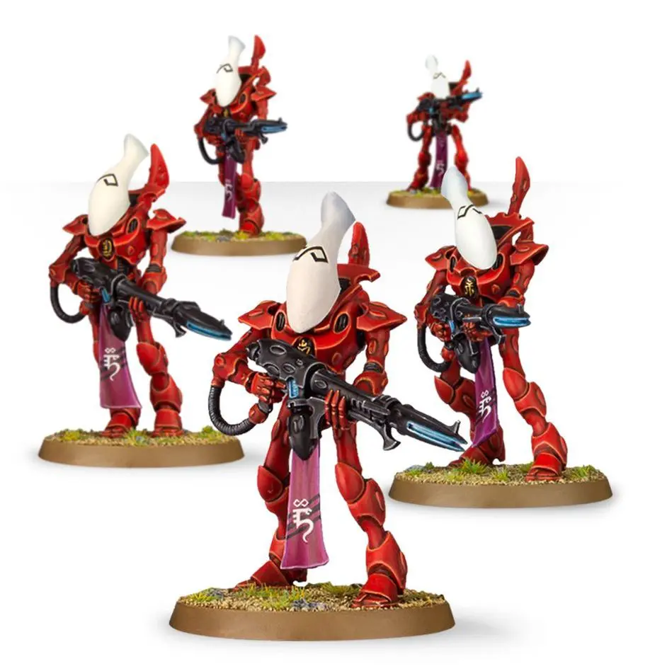 Group of five red and black fantasy warrior miniatures with white helmets.