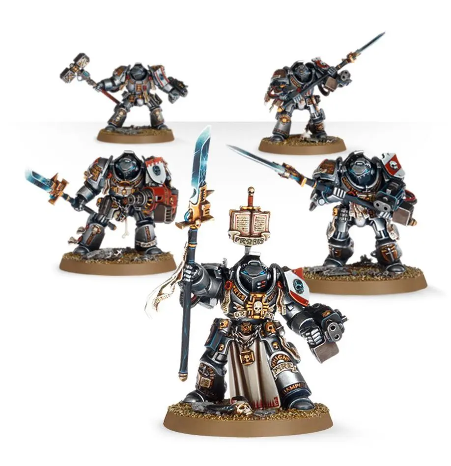 Five detailed Warhammer 40K miniatures in battle poses with weapons and armor.