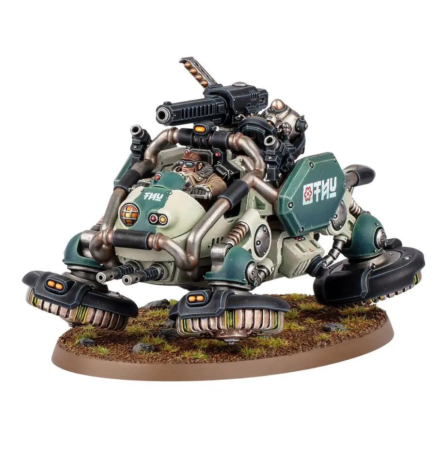A detailed miniature sci-fi vehicle with mechanical arms and weapons on a base.