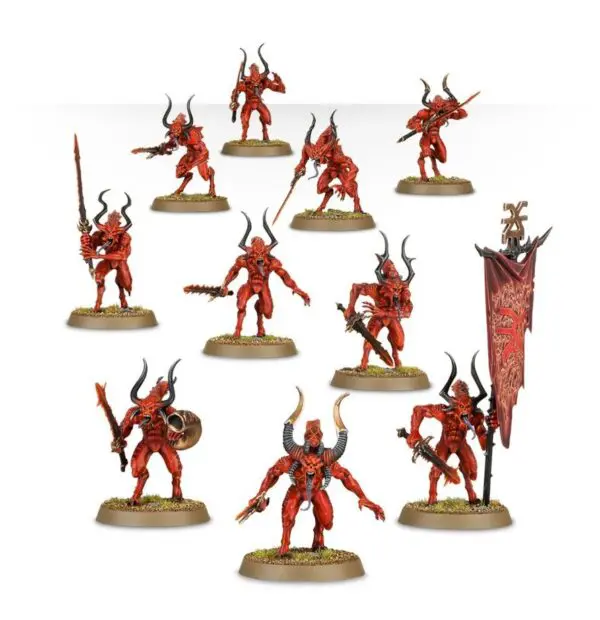 Miniature fantasy warriors with red armor and horns in battle poses.