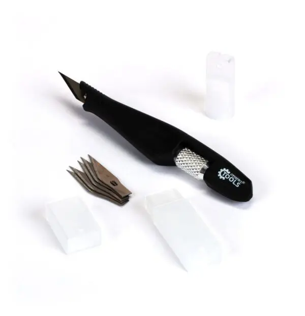 Black electric callus remover with replacement heads and protective caps.