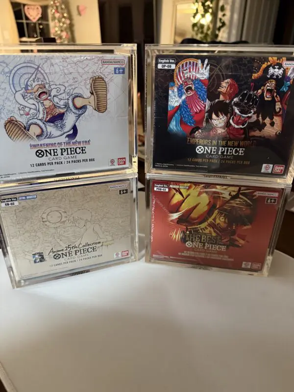 Four One Piece video game cases with distinct cover art.